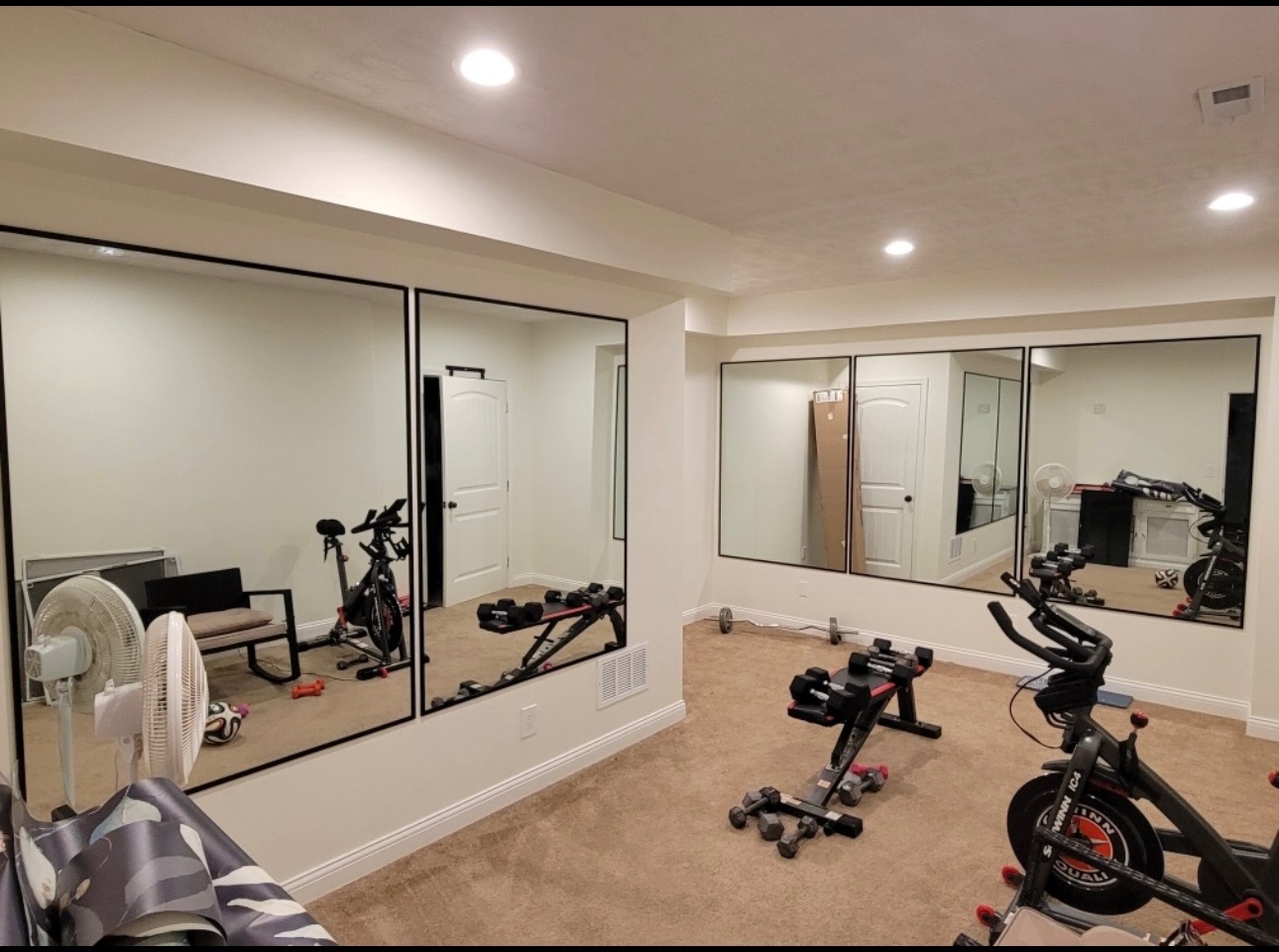 Gym mirror wall installation by Scottsburg Glass Inc.